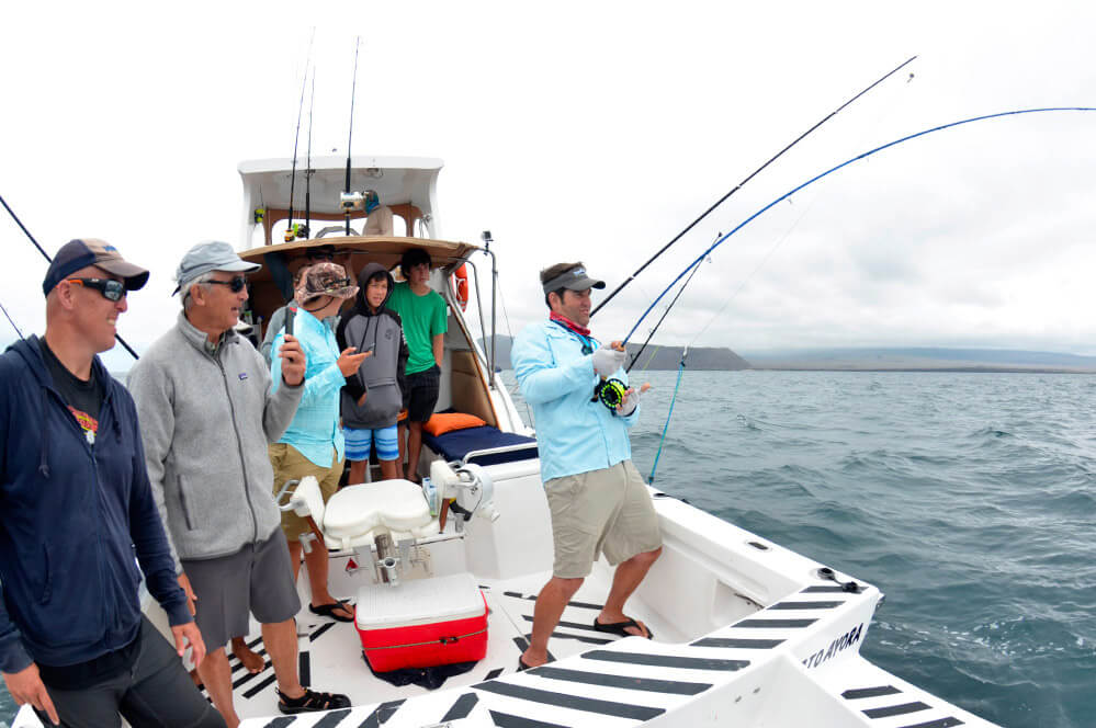 Fishermen over a boat in Galapagos