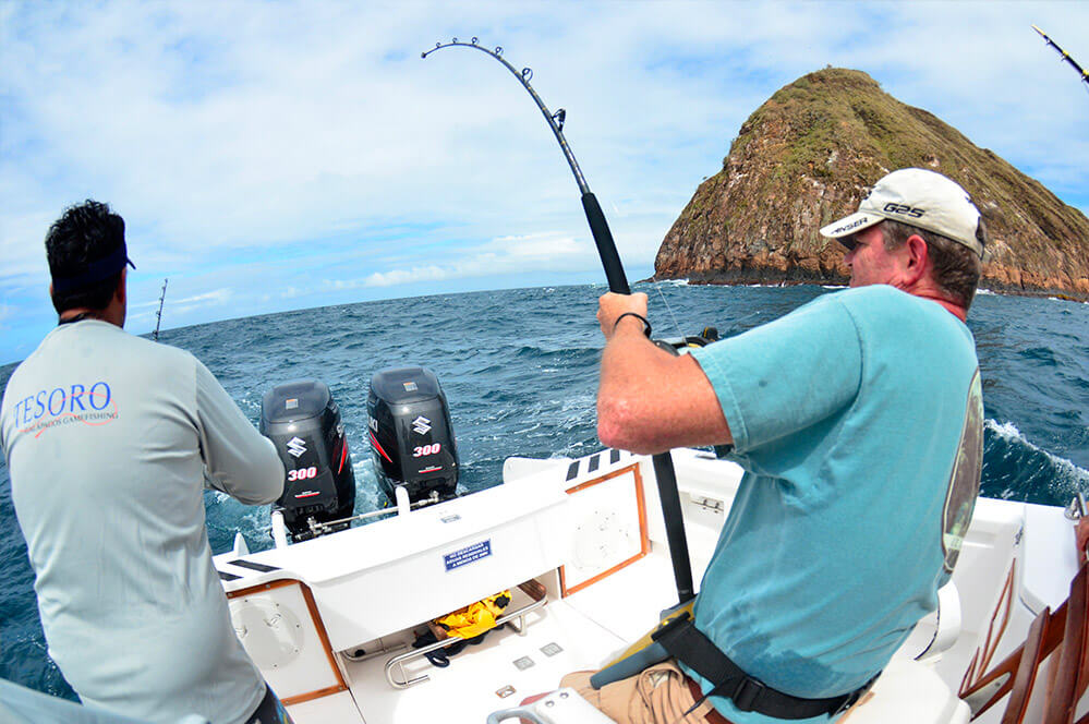 Fishermen catching and releasing fishes in Galapagos