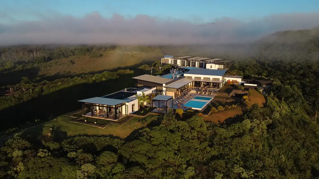 Pikaia Lodge buildings on a misty Galápagos hillside