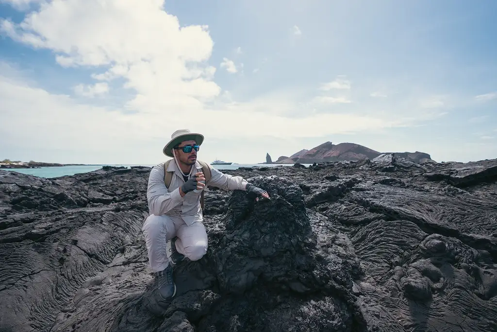 Naturalist guide among volcanic rocks in the Galápagos