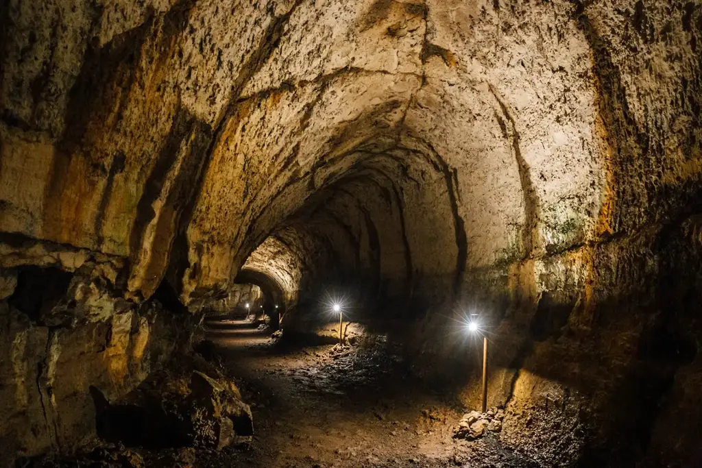 Lit volcanic lava tunnel on Santa Cruz Island