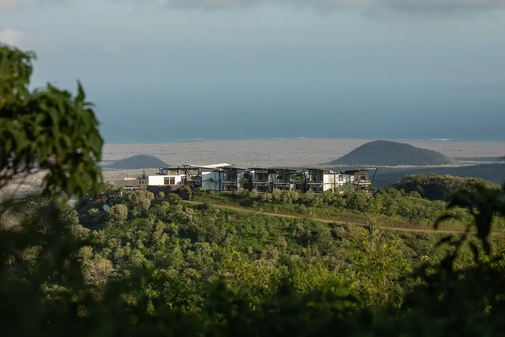 Lodge nestled on highland hillside overlooking the ocean